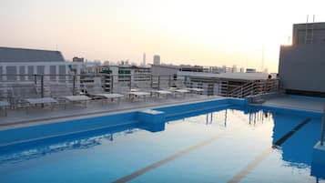 Outdoor pool, open 9:00 AM to 9:00 PM, pool loungers