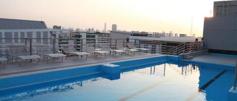 Outdoor pool, open 9:00 AM to 9:00 PM, sun loungers
