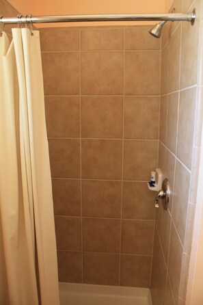 Habitación Deluxe, 1 cama King size | Regadera en el baño
