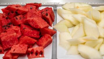 A tray with watermelon and apple slices.