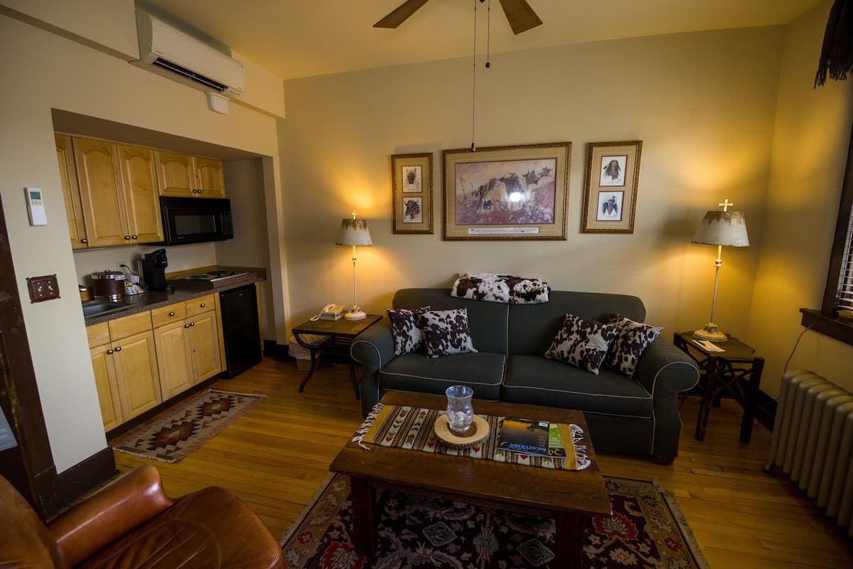 grand suite, 1 king bed | living area | 42-inch plasma tv with premium tv channels, tv, dvd player