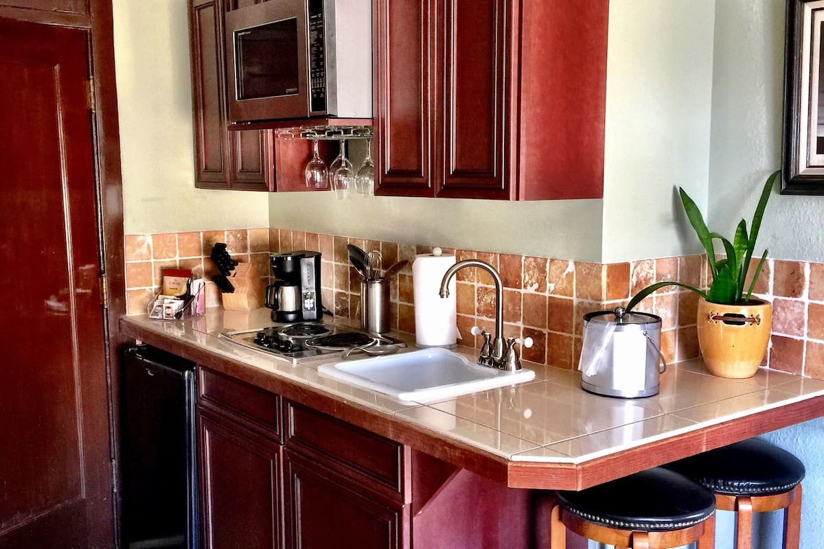 grand suite, 1 king bed | private kitchenette | fridge, microwave, coffee/tea maker, cookware/dishes/utensils