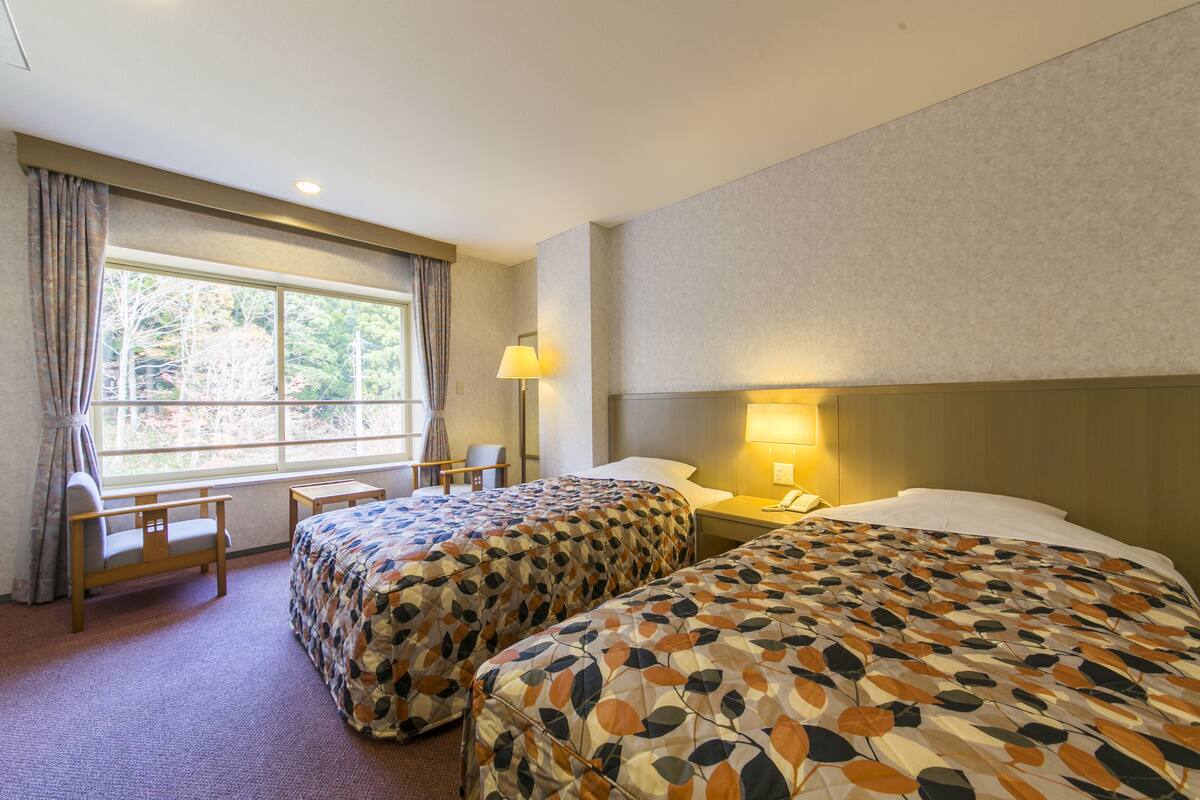 Twin Room, Shared Bath, Non Smoking | Desk, blackout curtains