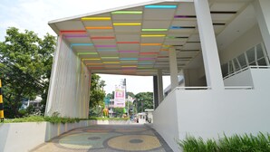 A modern building with a colorful ceiling and a patterned floor.