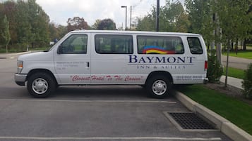 A white van with "Baymont Inn & Suites Erie" and "Closest Hotel To The Casino" written on the side.