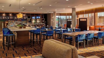 Relax in our stylish lobby with comfortable seating areas, a central bar, and a variety of beverages.