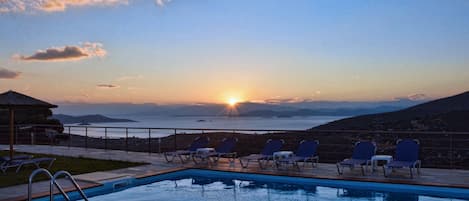 Outdoor pool, pool umbrellas, pool loungers