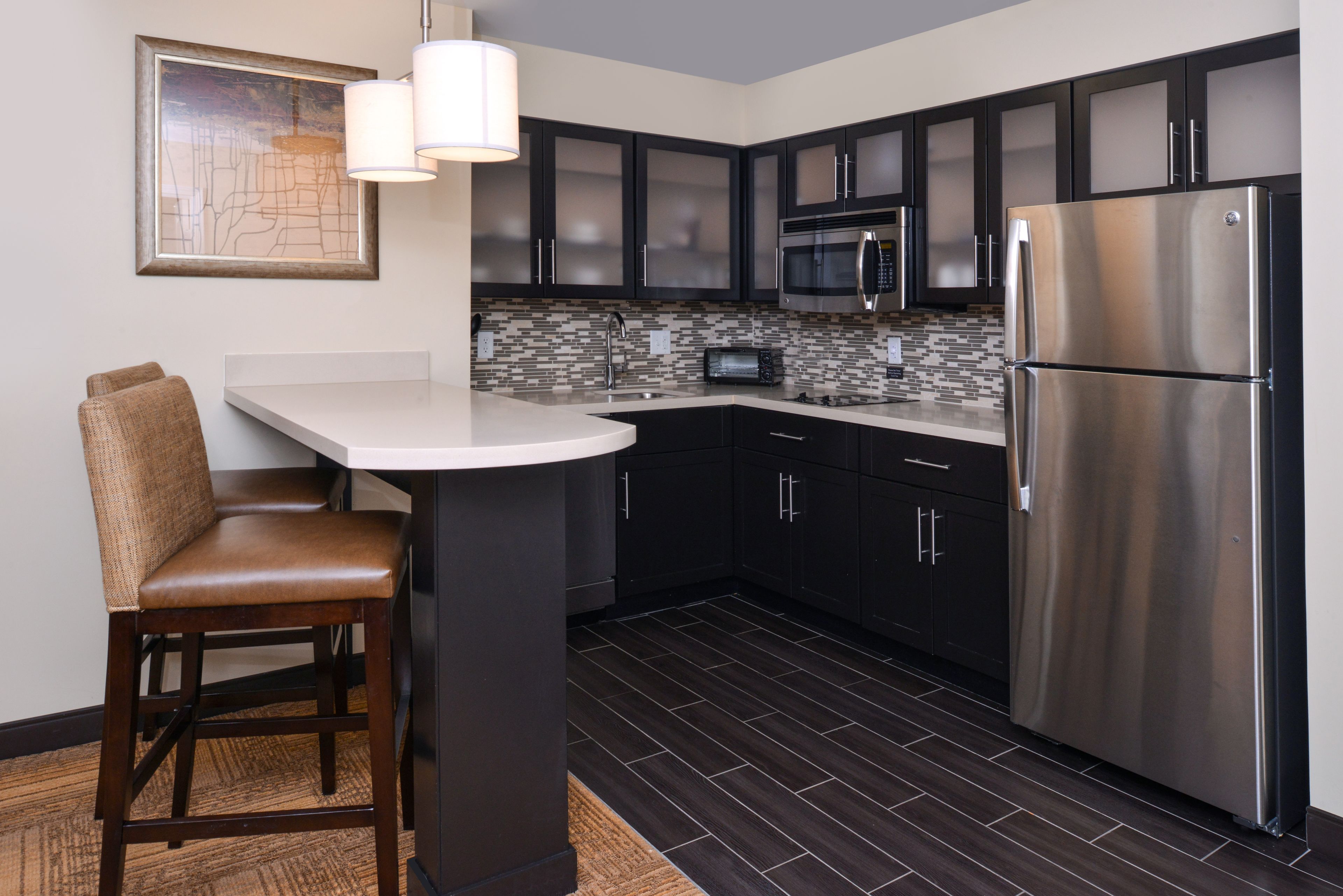 full-sized fridge, microwave, stovetop, dishwasher