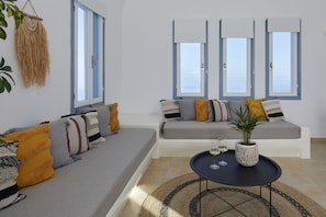 Suite with Outdoor Hot Tub | Living area | LCD TV - Athiri Santorini Hotel (Santorini)