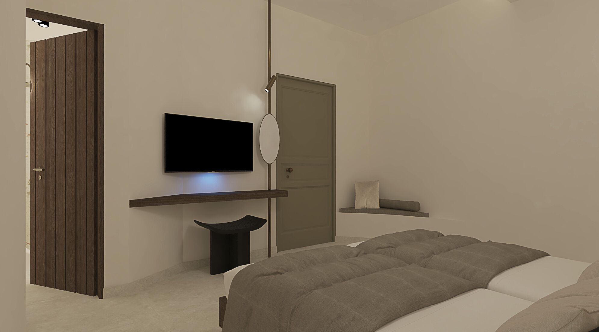 A bedroom with a bed, a TV mounted on the wall, a wardrobe, and a small table with a lamp.
