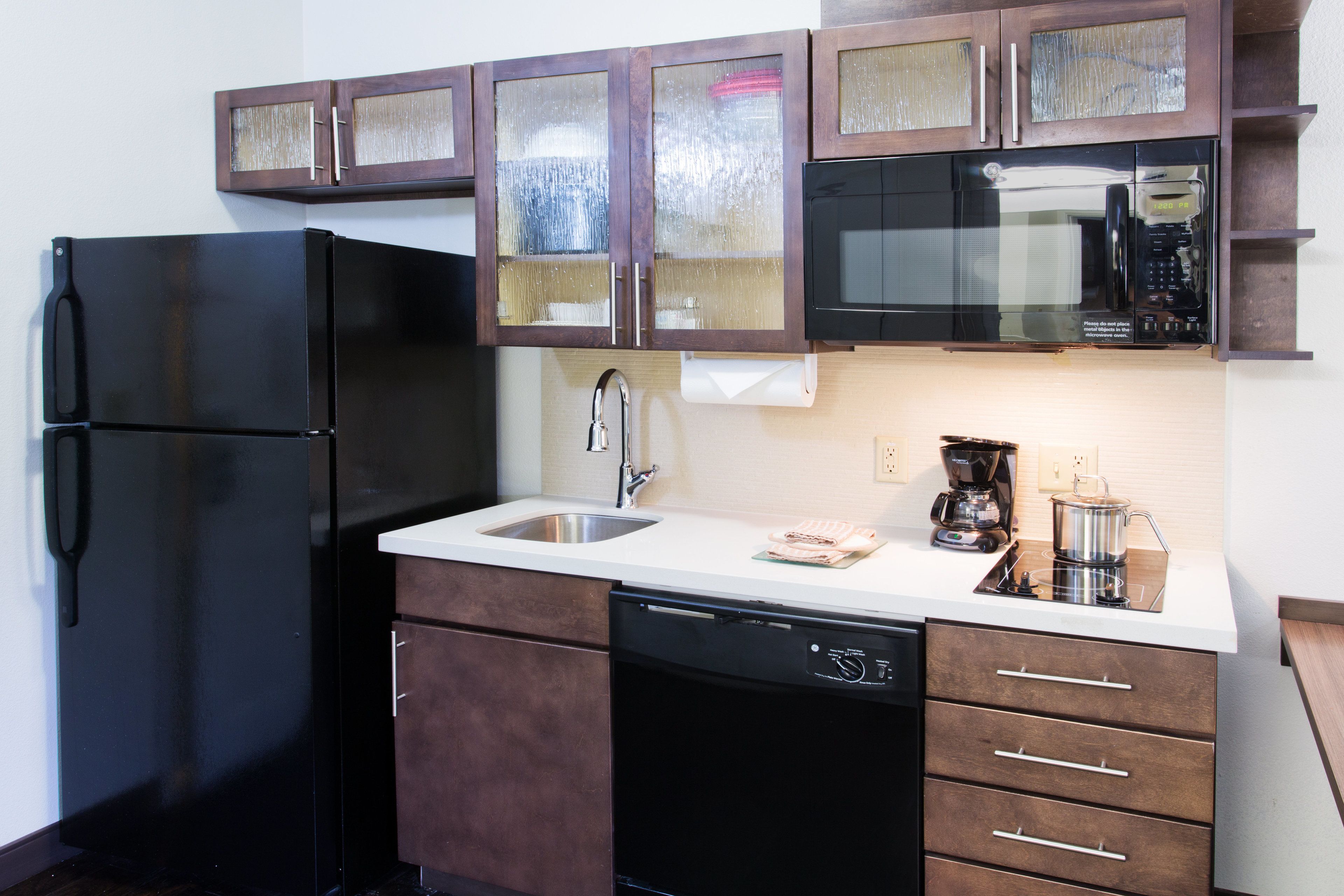 full-sized fridge, microwave, stovetop, dishwasher