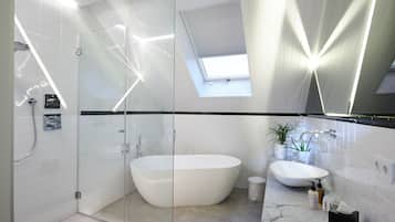 Shower, designer toiletries, hair dryer, bathrobes