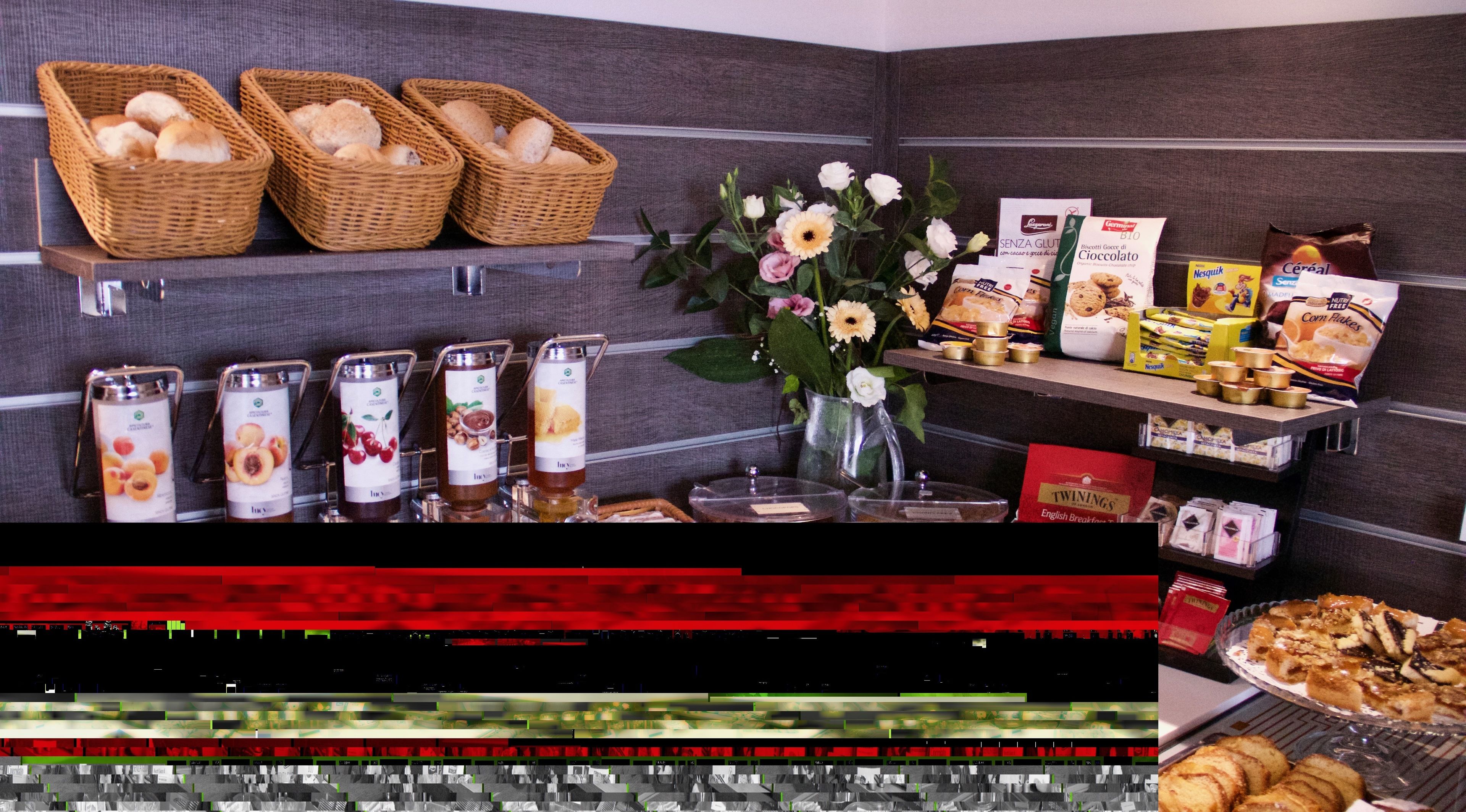 A breakfast buffet with various food items and beverages.