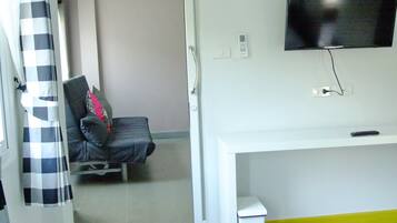 Suite, 1 Bedroom | Living area | LCD TV