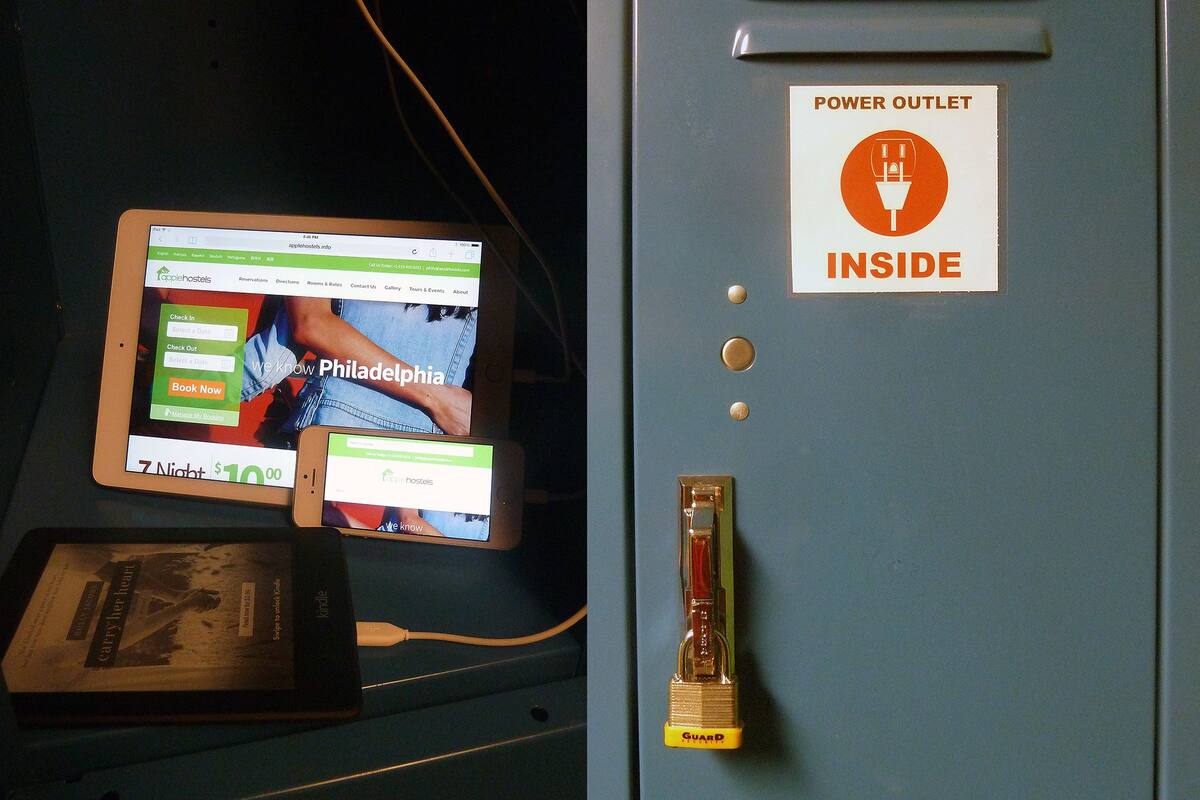 A tablet displaying a hotel booking website, a power outlet sign, and a lock on a door.