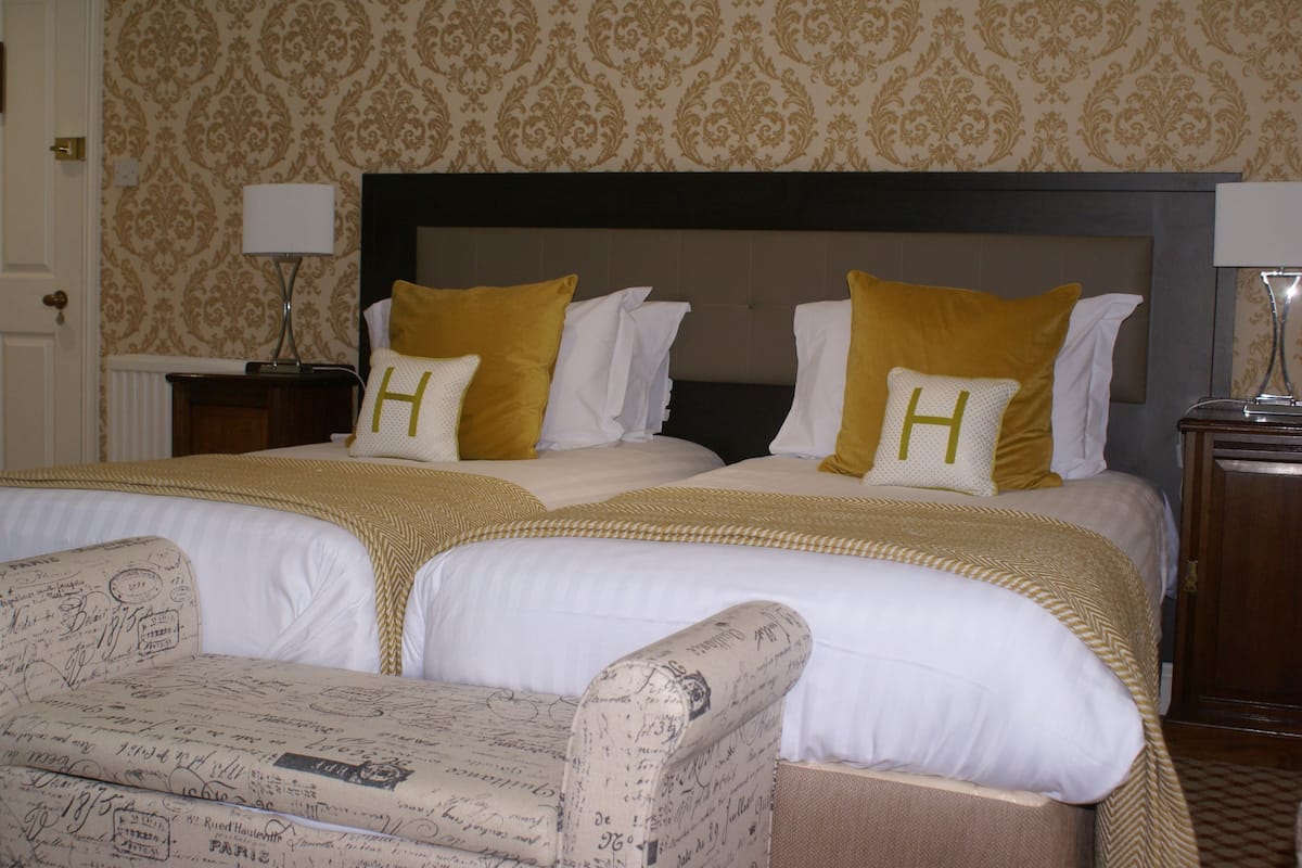 desk, laptop workspace, blackout curtains, iron/ironing board