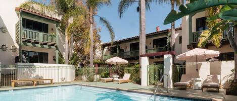 Outdoor pool, pool umbrellas, sun loungers