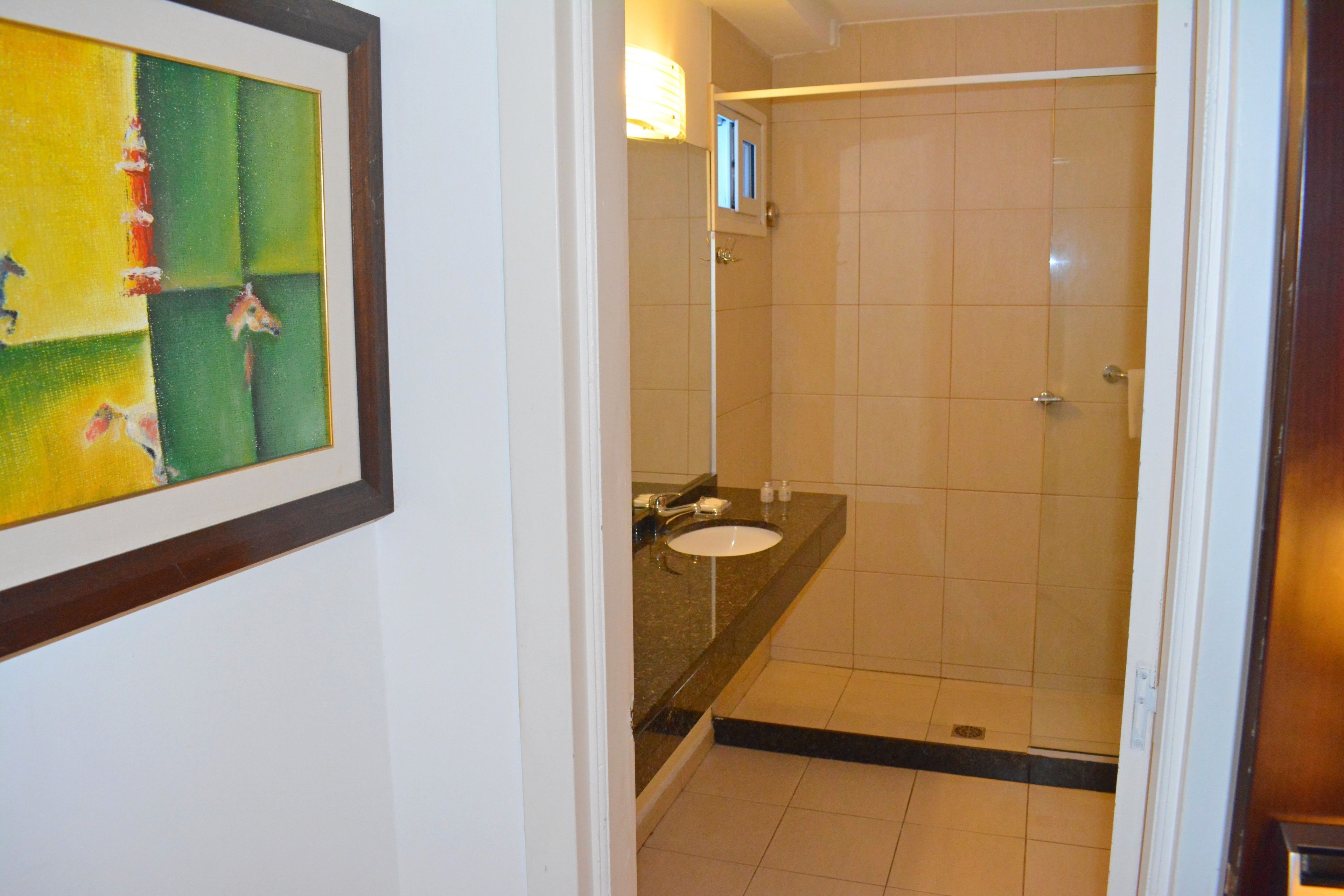 deep-soaking bathtub, rainfall showerhead, free toiletries, hair dryer