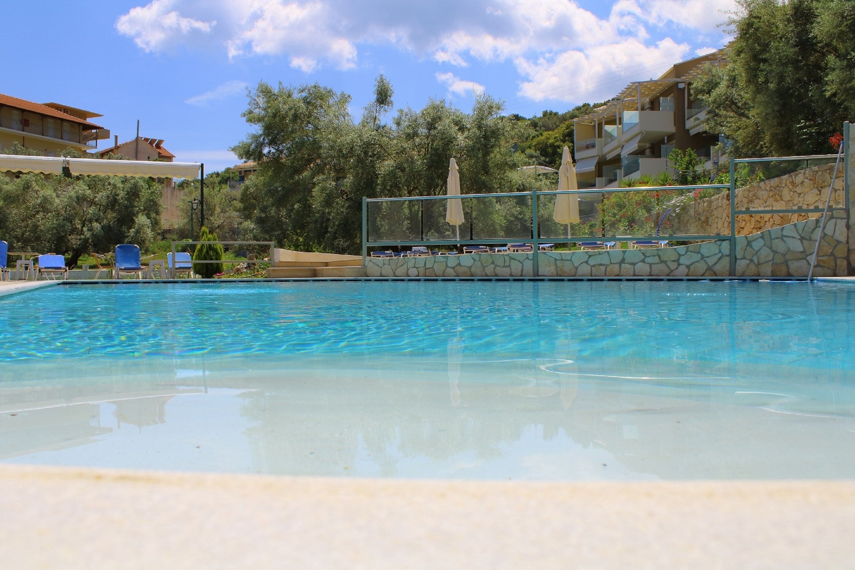 Seasonal outdoor pool, pool umbrellas, pool loungers