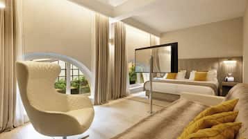 Junior Suite | Living area | 42-inch flat-screen TV with digital channels, TV