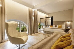 Junior Suite | Living area | 42-inch flat-screen TV with digital channels, TV