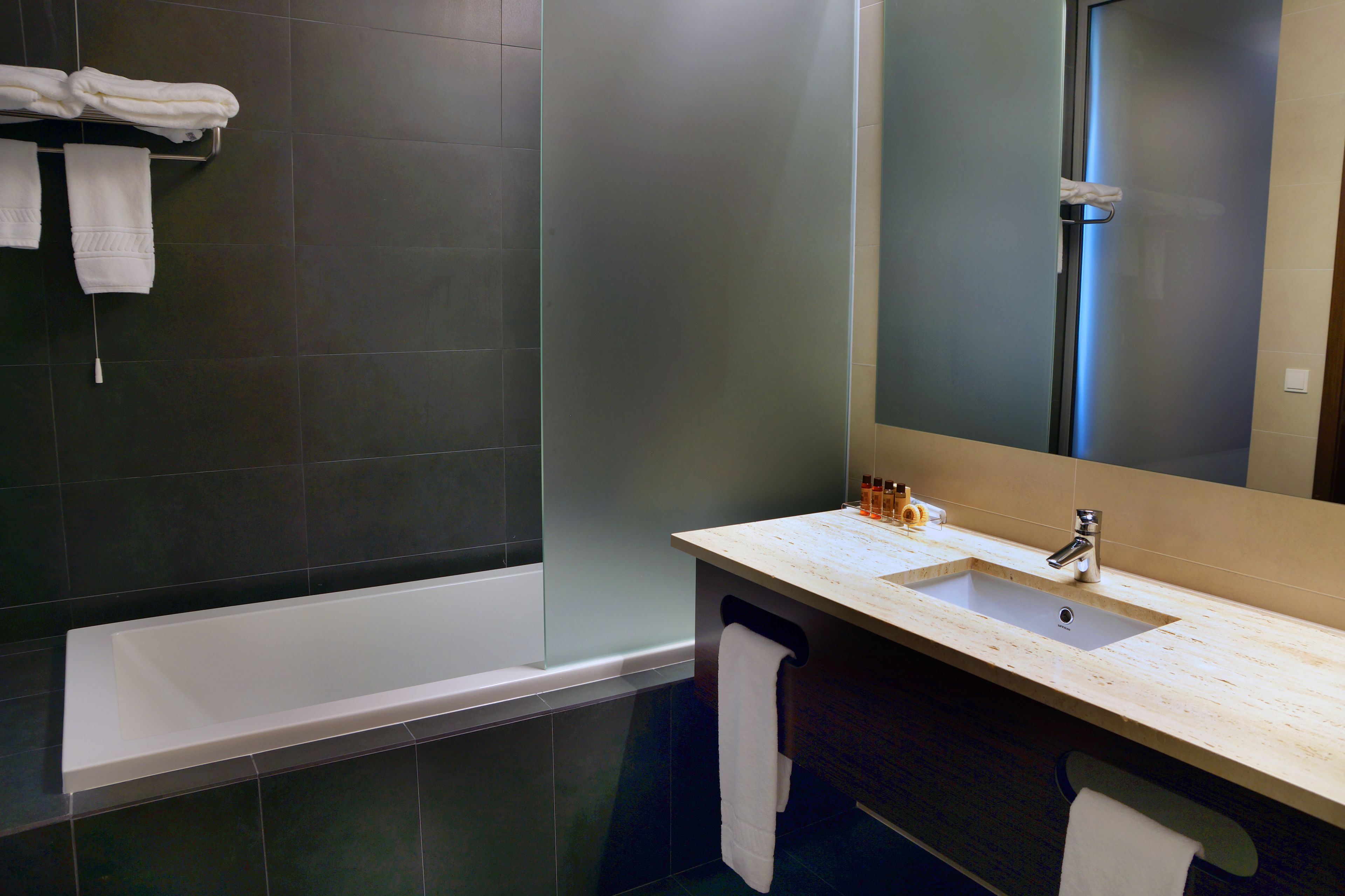 bathtub, rainfall showerhead, free toiletries, hair dryer