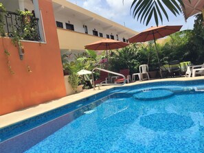 Outdoor pool, pool umbrellas, sun loungers