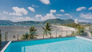 A swimming pool with a view of a beach and ocean. - Patong Signature Boutique Hotel (Patong)