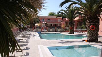 Outdoor pool, pool umbrellas, sun loungers