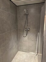 Quadruple Room | Bathroom | Shower, hair dryer, towels