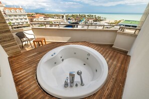 Junior Suite, Partial Sea View | Minibar, in-room safe, desk, laptop workspace