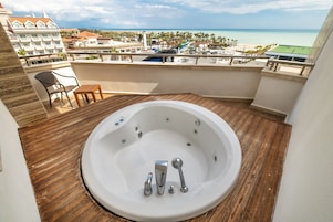 Junior Suite, Partial Sea View | Minibar, in-room safe, desk, laptop workspace