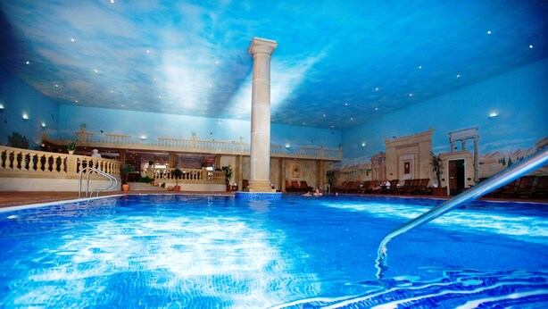 An indoor swimming pool with a clear view of the ceiling and architectural details. - Whittlebury Hall Hotel & Spa (Towcester)