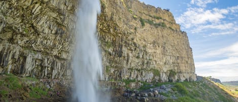 A waterfall cascading down a rocky cliff.