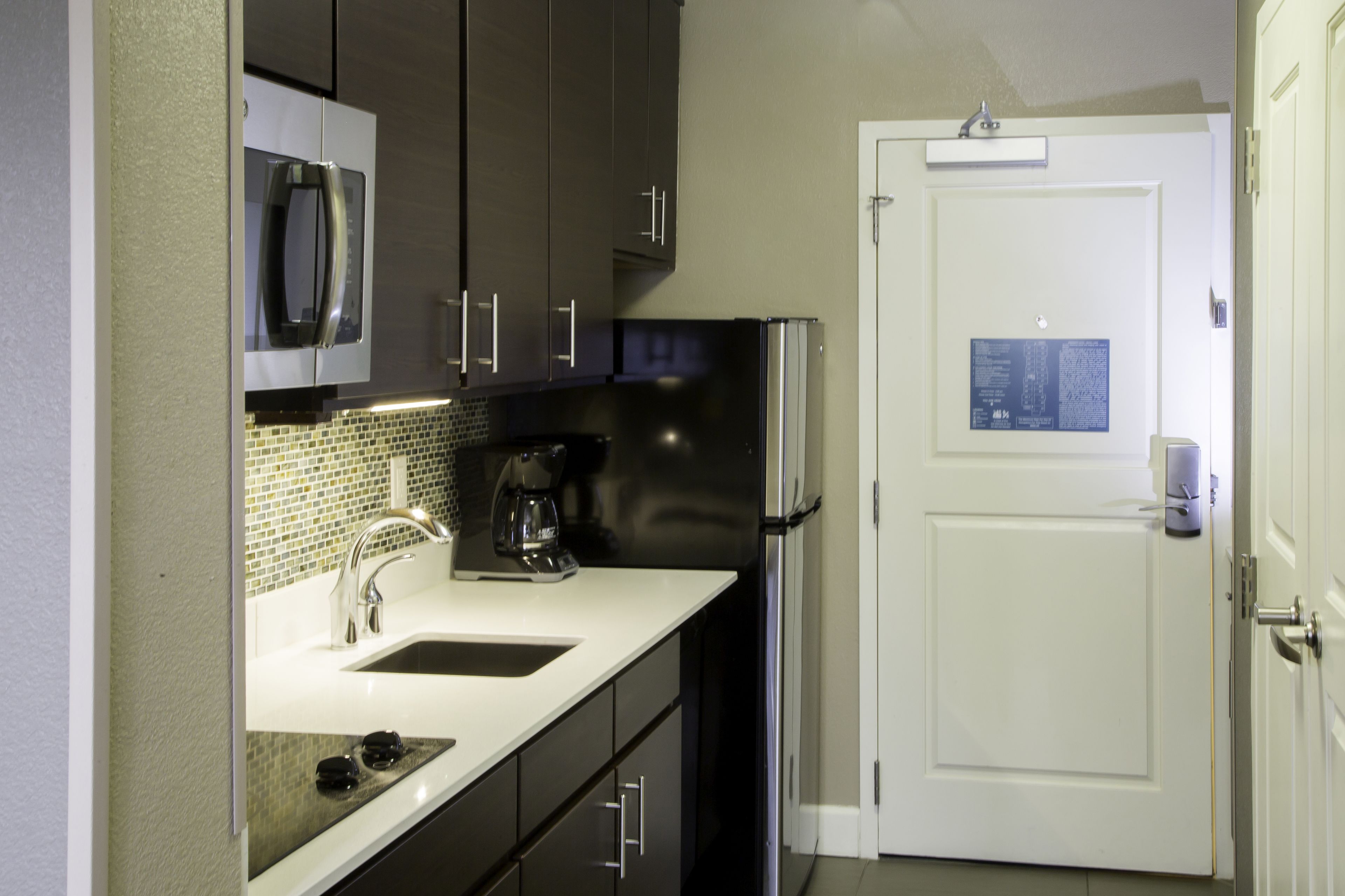 full-sized fridge, microwave, stovetop, dishwasher