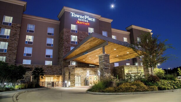 TownePlace Suites Marriott with a stone facade, multiple windows, and a covered entrance. - TownePlace Suites Oxford (Oxford)