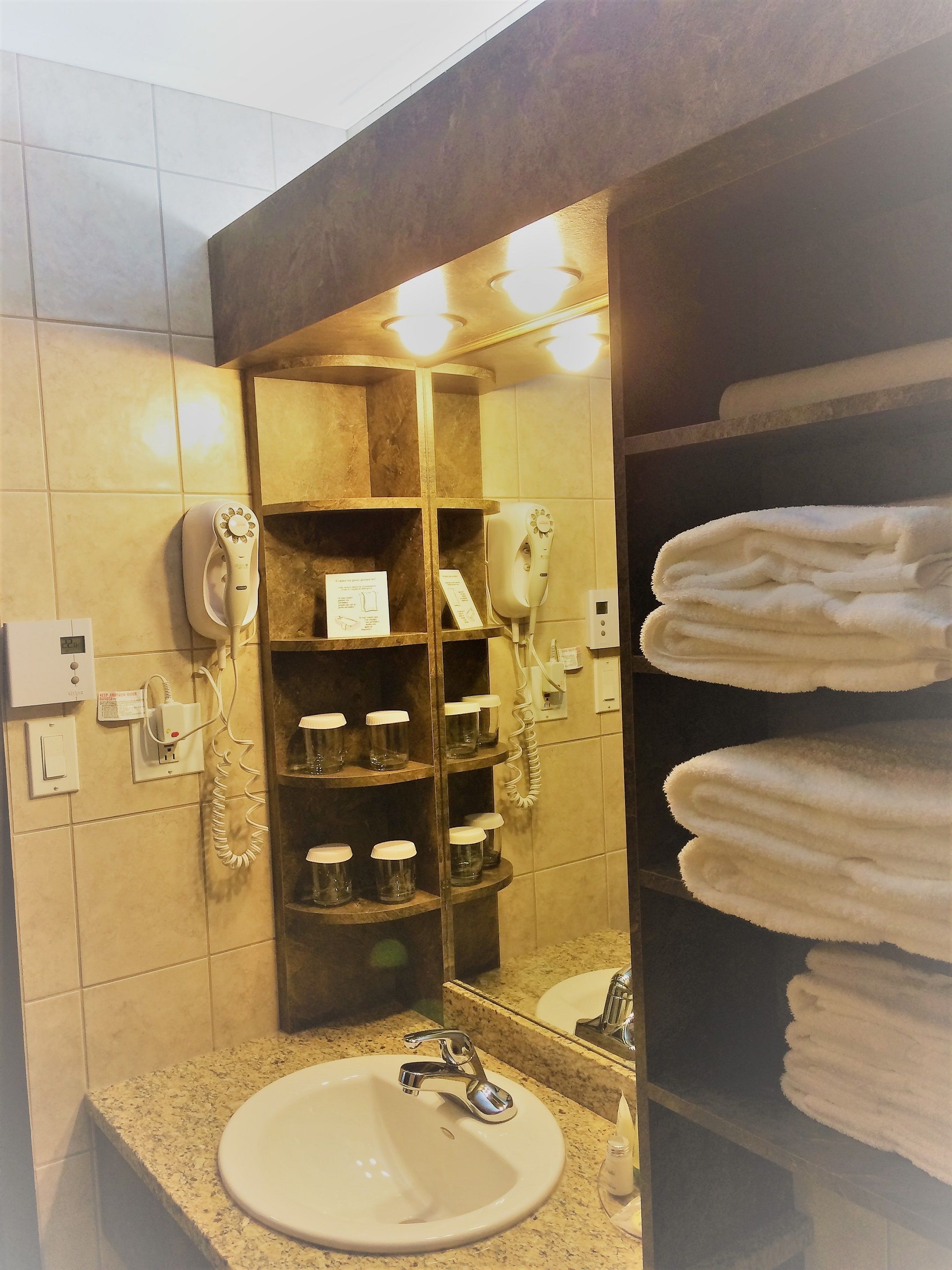 shower, designer toiletries, hair dryer, towels