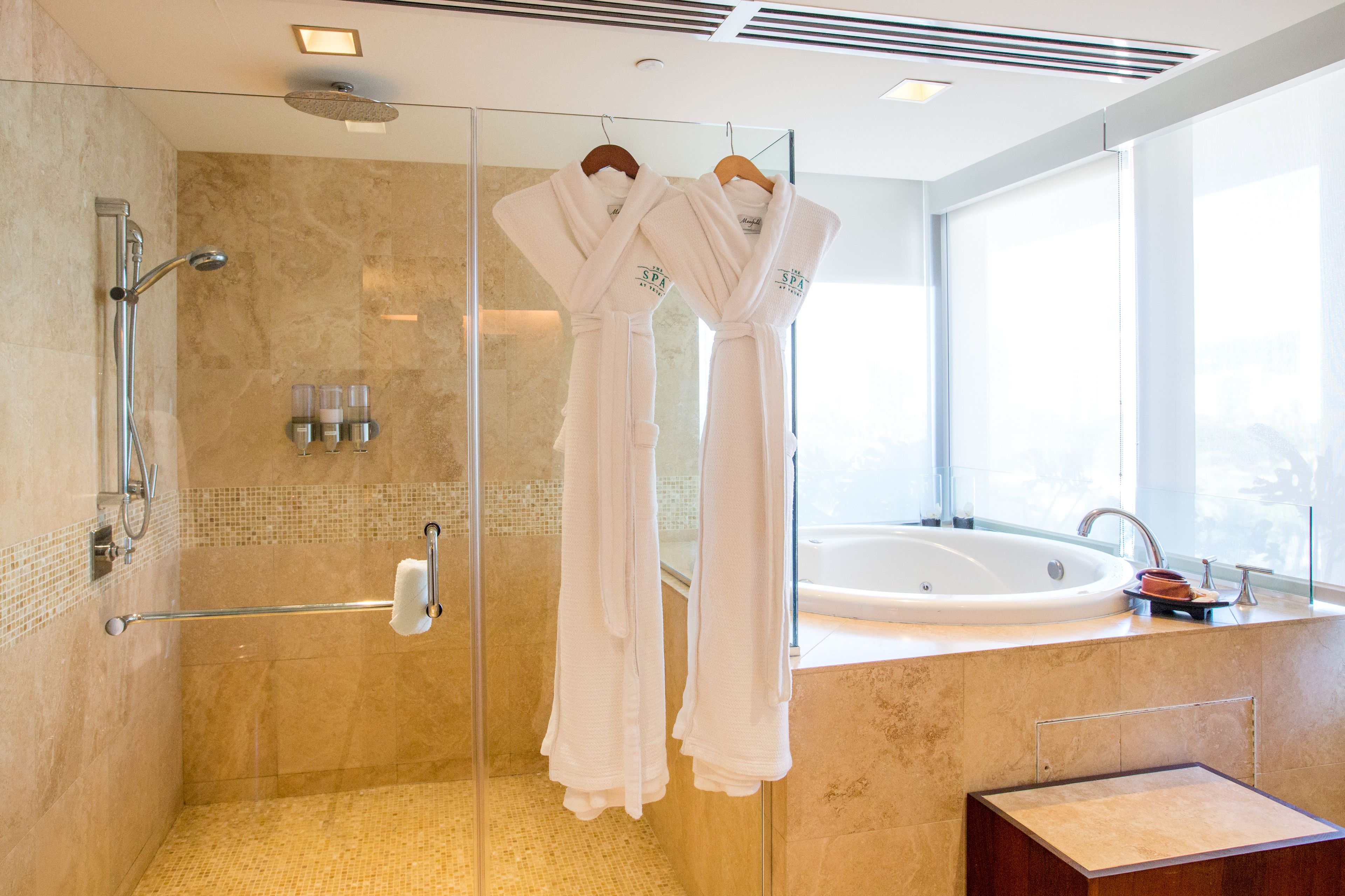 separate bathtub and shower, deep-soaking bathtub, designer toiletries