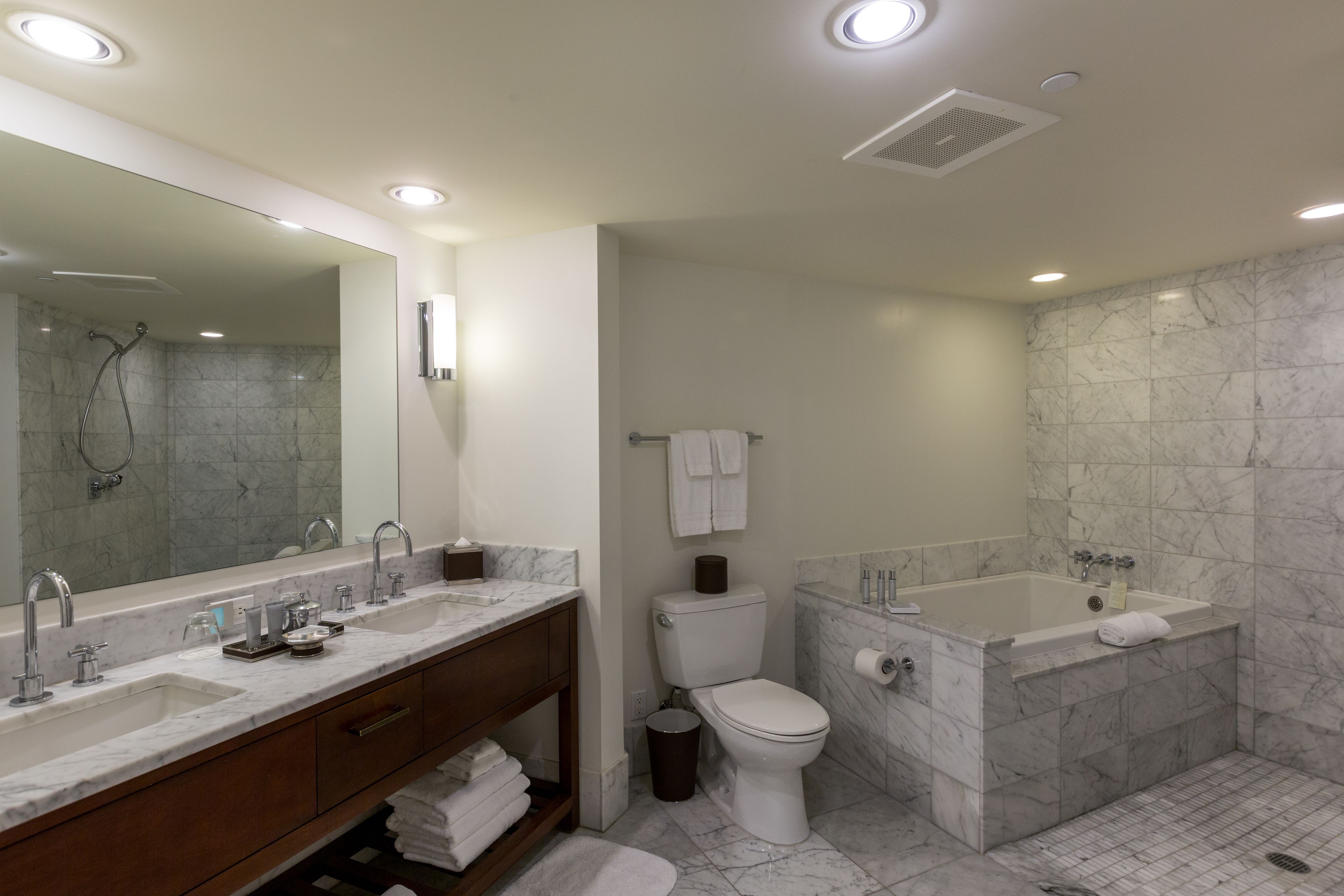 separate bathtub and shower, deep-soaking bathtub, designer toiletries