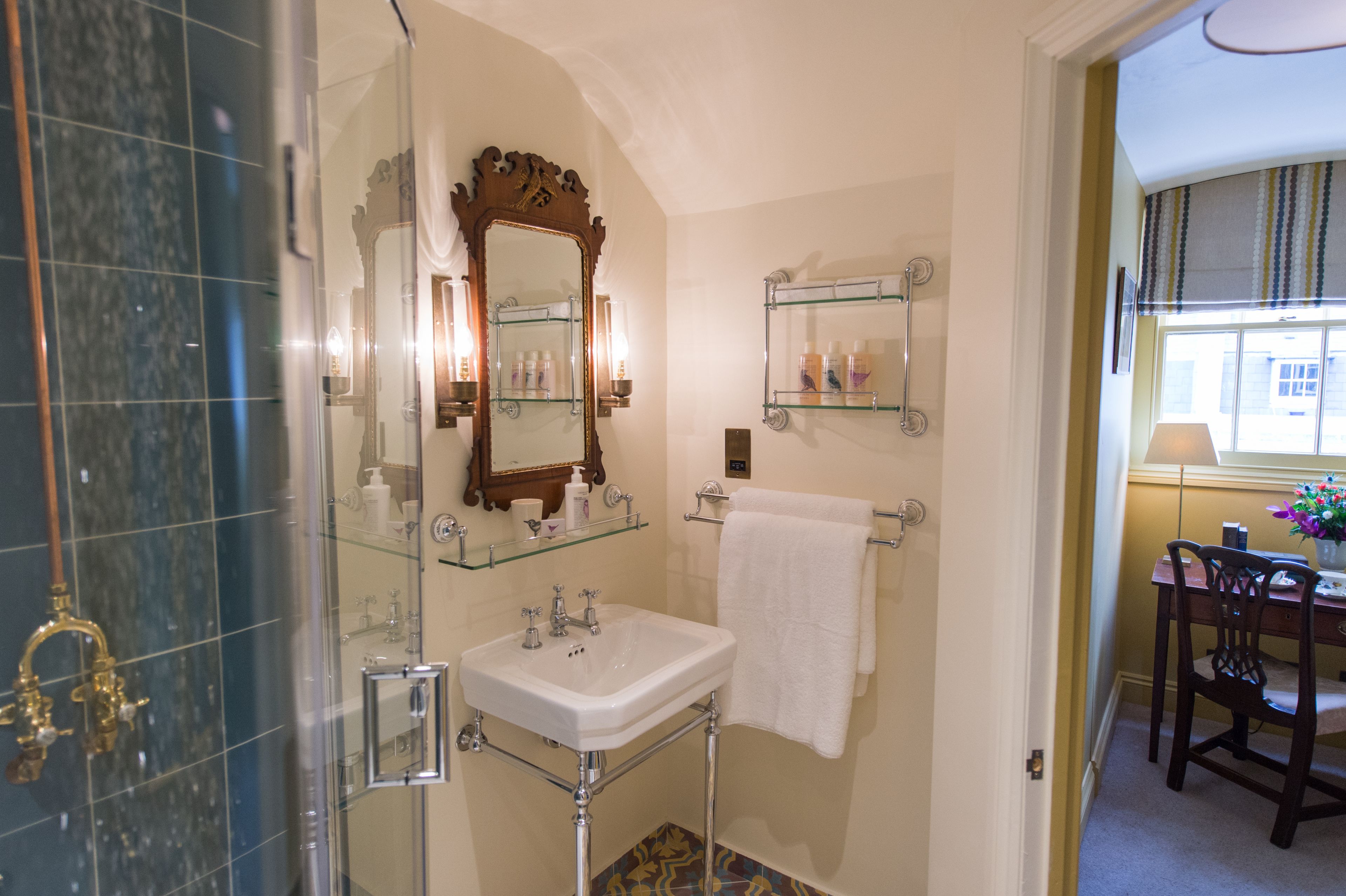 designer toiletries, hair dryer, bathrobes, slippers