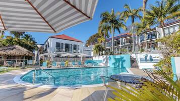 Outdoor pool, a heated pool, open 8:00 AM to 7:00 PM, free pool cabanas