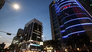 A modern building with illuminated signage and a clear sky. - KSTAR Metro Hotel (Seoul)