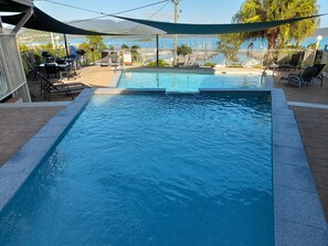 Outdoor pool, open 7:00 AM to 9:00 PM, sun loungers