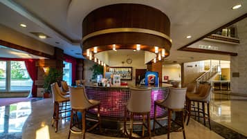 3 bars/lounges, poolside bar, beach bar