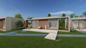 A modern house with a spacious patio, large windows, and a well-maintained lawn.