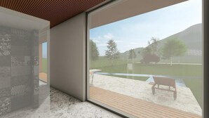 A modern interior with a large sliding glass door leading to an outdoor deck with a bench. - Casa Arrigo (Linguaglossa)