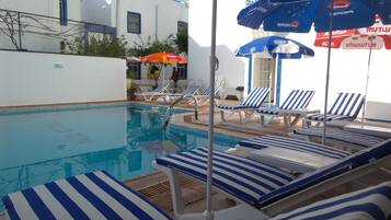 Outdoor pool, pool umbrellas, pool loungers