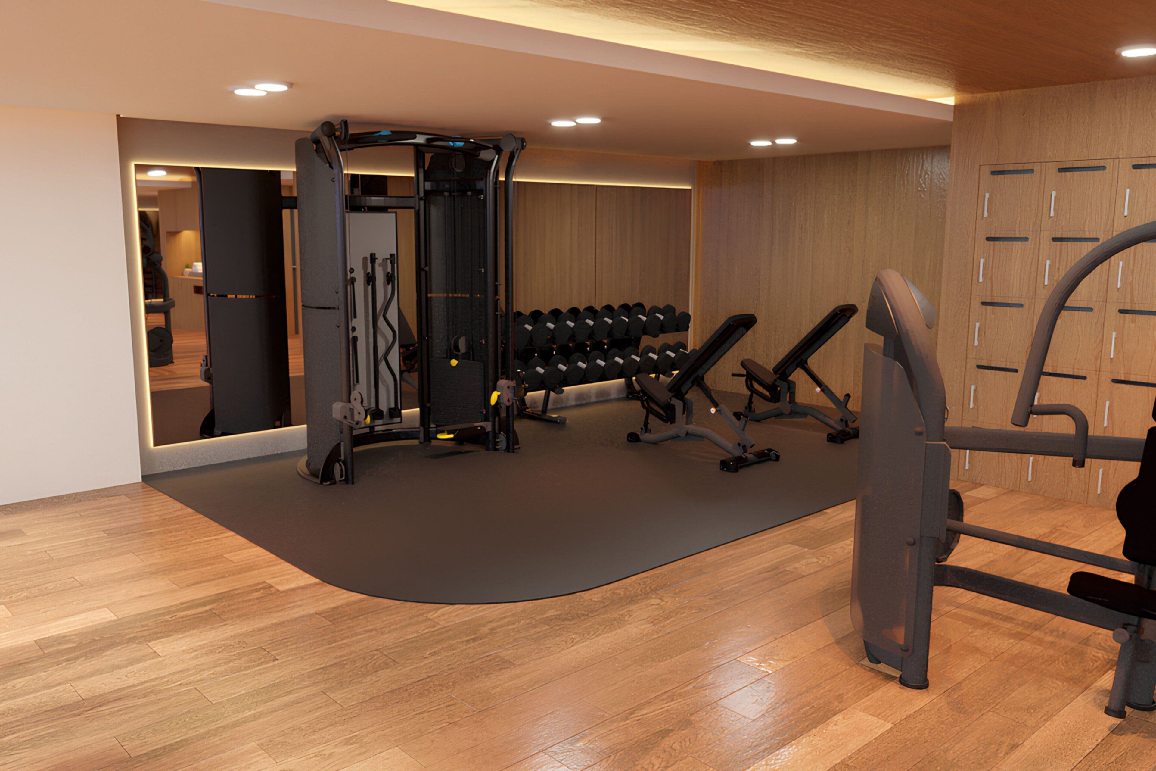 A modern gym with exercise equipment, a mirrored wall, and wooden flooring.