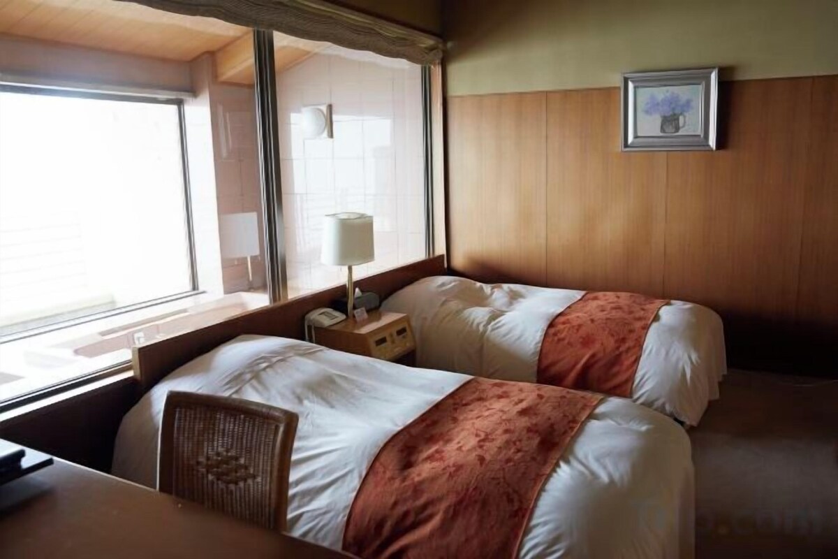 Minibar, desk, bed sheets