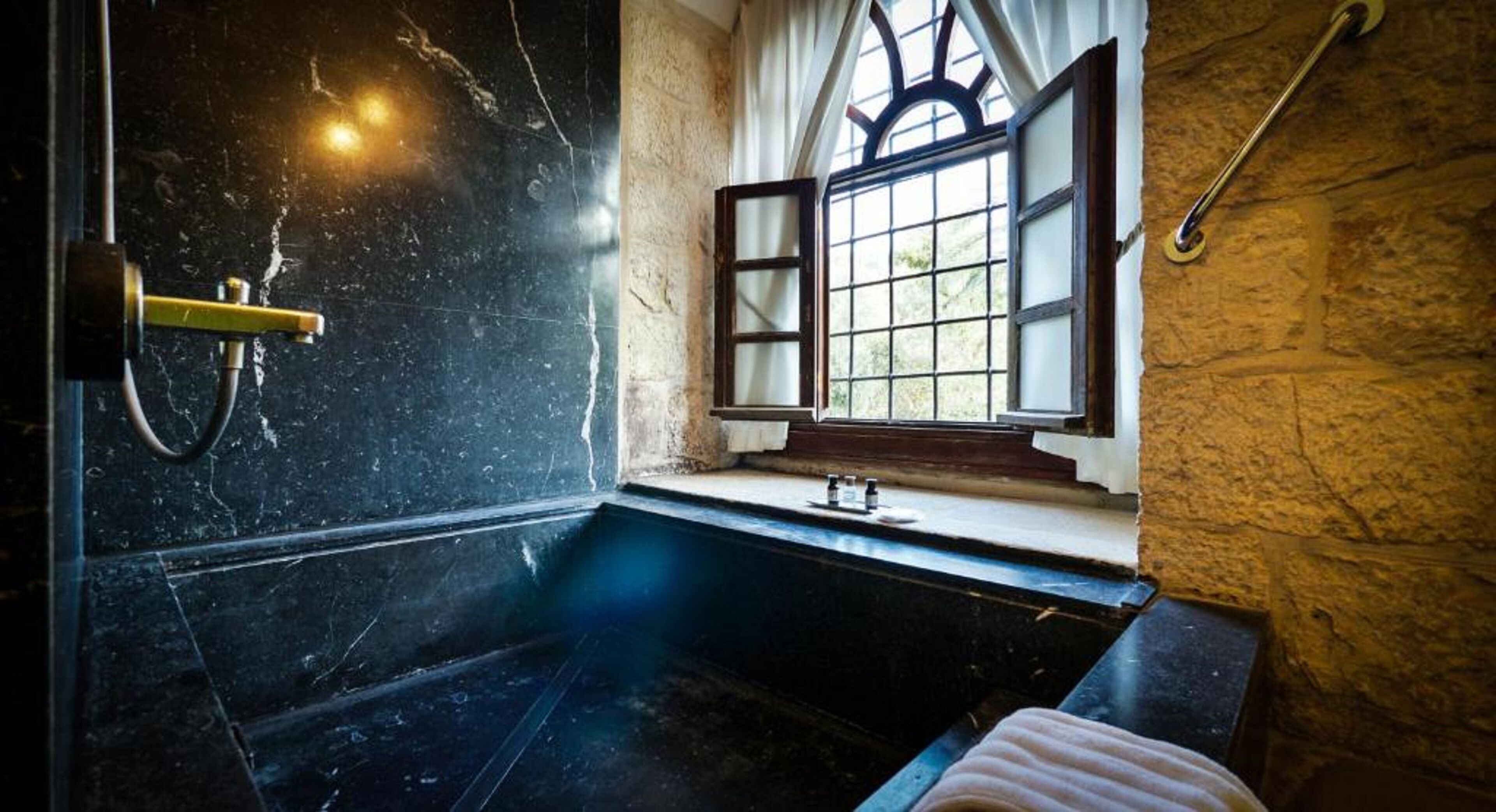 signature suite, bathtub | bathroom | shower, free toiletries, hair dryer, bathrobes
